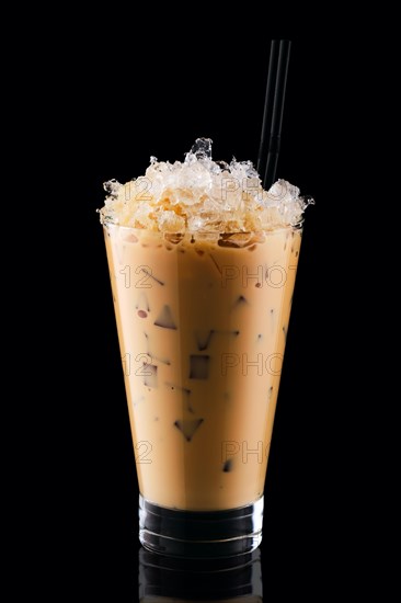 Milkshake with coffee and crushed ice isolated on black background