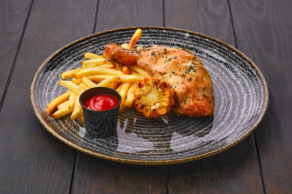 Baked chicken thigh with french fries