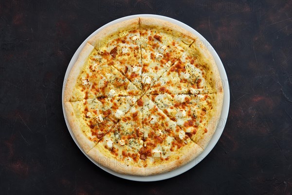 Top view of pizza with five kind of cheese