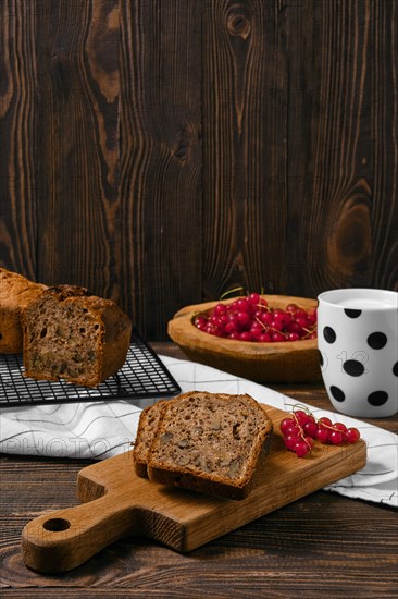 Fresh biscuit cake with walnut on wooden table