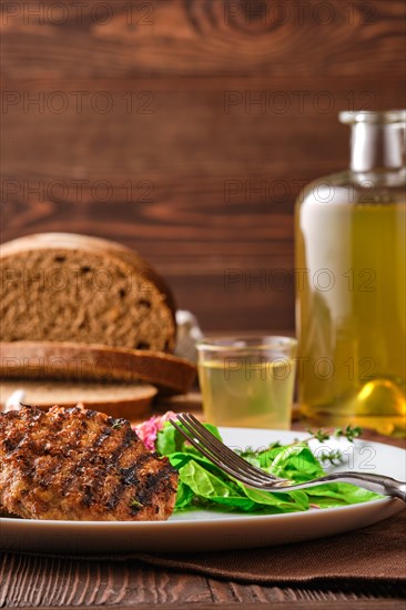 Grilled beef cutlet with fresh salad