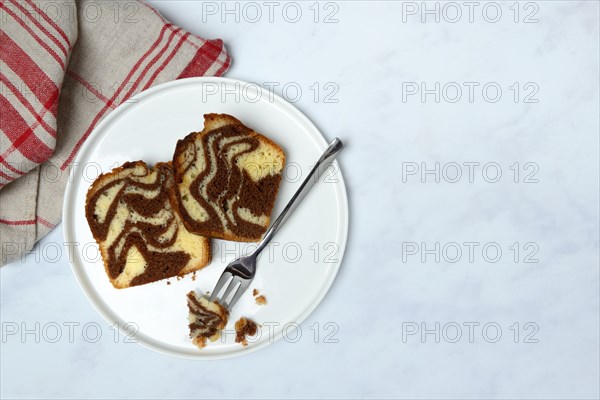 Two pieces of marble cake on plate