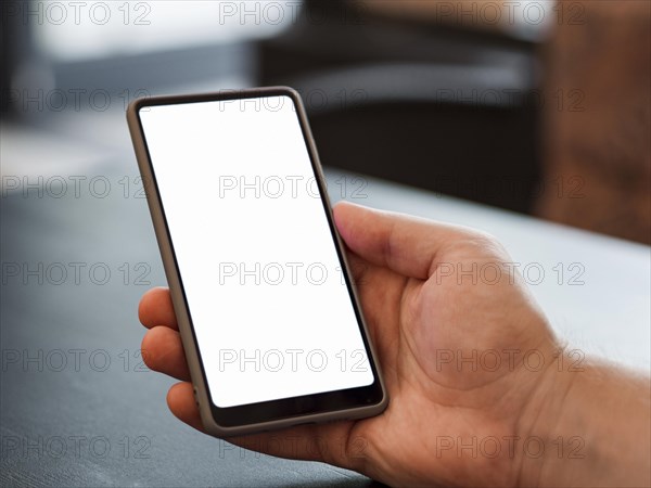 Close up hand holding phone mock up