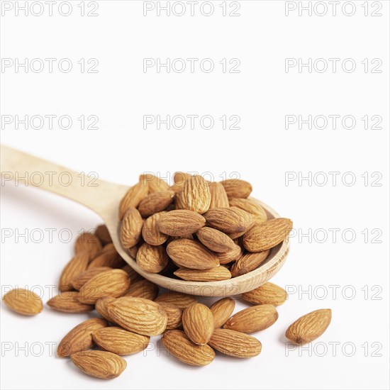 High angle almonds spoon with copy space
