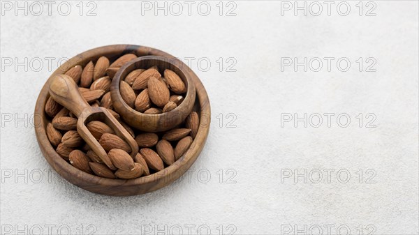 Organic almond nuts bowl copy space