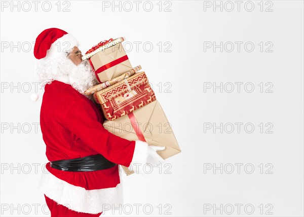 Santa claus bringing christmas presents