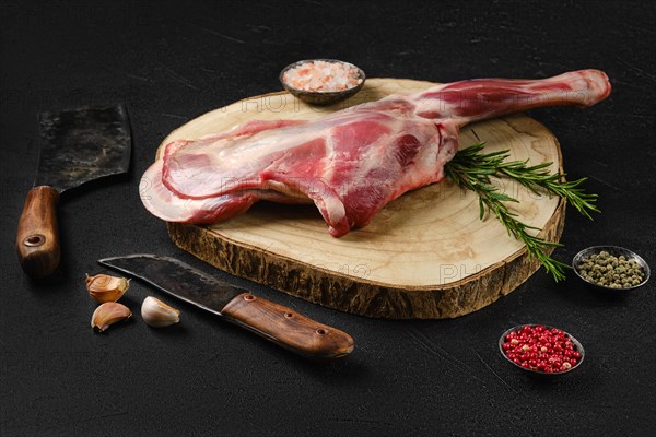 Raw fresh lamb shoulder on black background