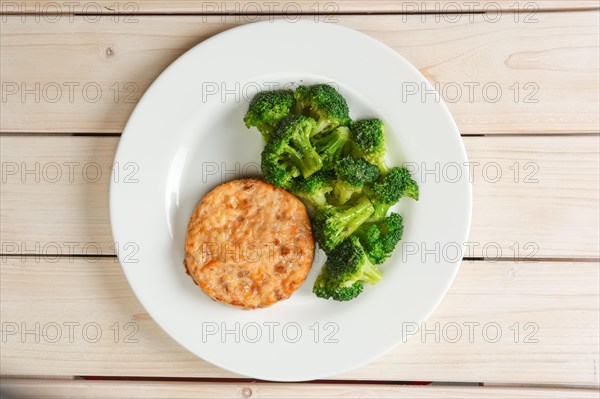 Meat cutlet with cheese and broccoli