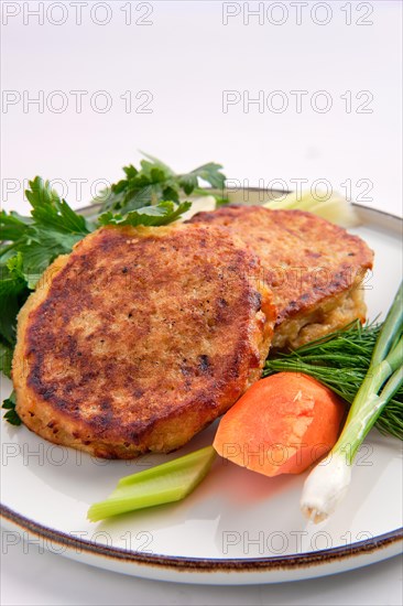 Fried ground beef and potato patties isolated on white background