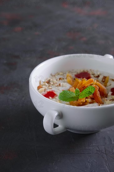 Plate of oatmeal with dried apricots