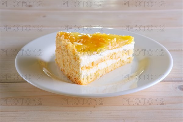 Layered orange cheesecake on plate
