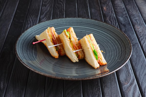 Appetizer for reception. Three mini club sandwich on plate