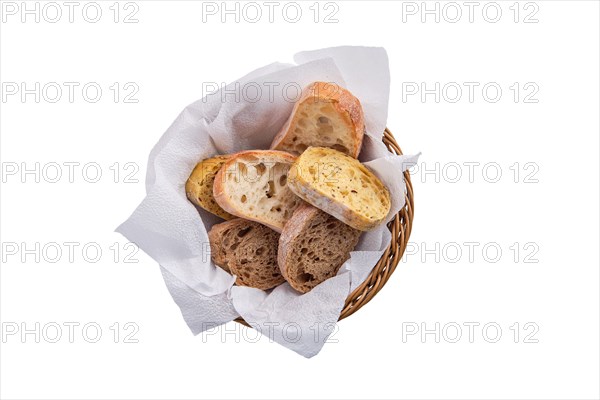 Top view of bread in the basket isolated on white background