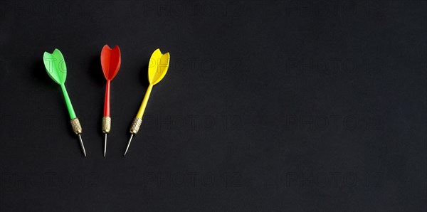 Flat lay colorful darts with copy space