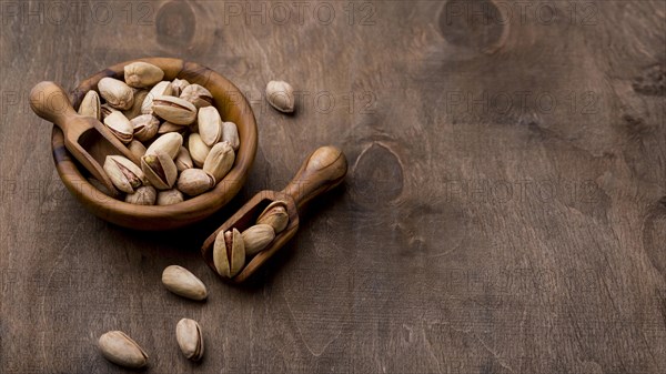 Roasted pistachio nuts wooden table