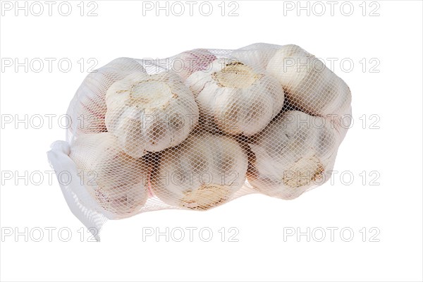 Pouch with garlic bulbs isolated on white