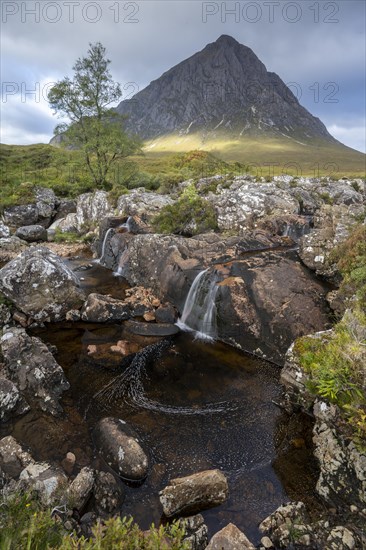 Waterfalls in front of mountain range Buachaille Etive Mor