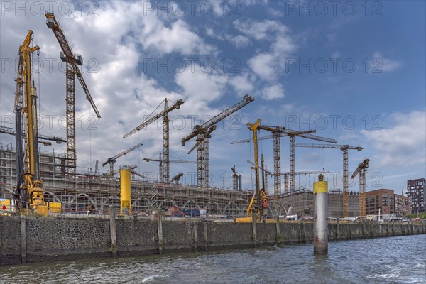 Construction cranes of a large construction site in the port of Hamburg
