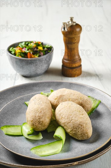 Semifinished frozen cepelinai. Potato dumplings stuffed with ground meat