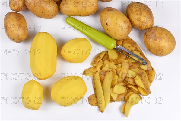 Top view of food preparation with peeled potatoes