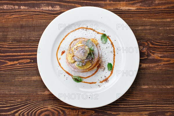 Overhead view of pancakes with ice cream