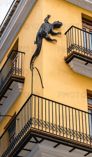 Yellow Building with a lizard on the facade