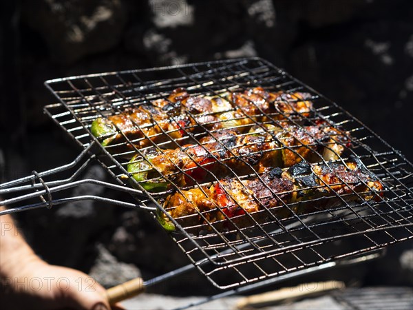 Chef roasting vegetables grill