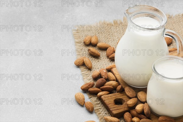 Close up fresh milk almonds with copy space