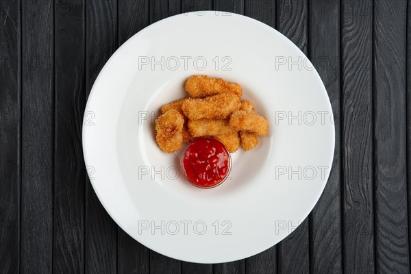 Deep fried chicken nuggets on a plate