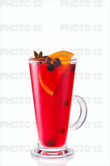 Hot black currant and orange winter drink with anise isolated on white