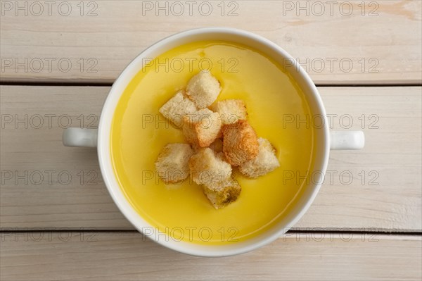 Chicken soup puree with white bread chips