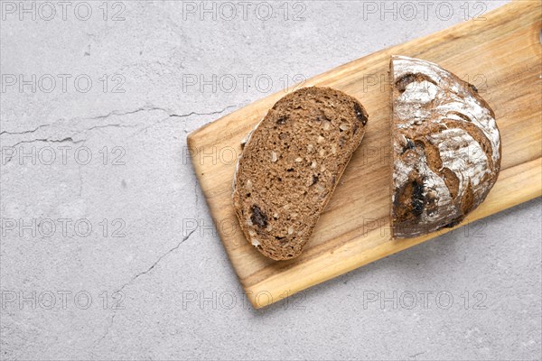 Fresh rye brown bread on wooden cutting board