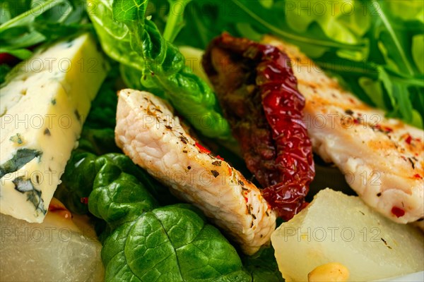 Macro photo of salad with roasted turkey