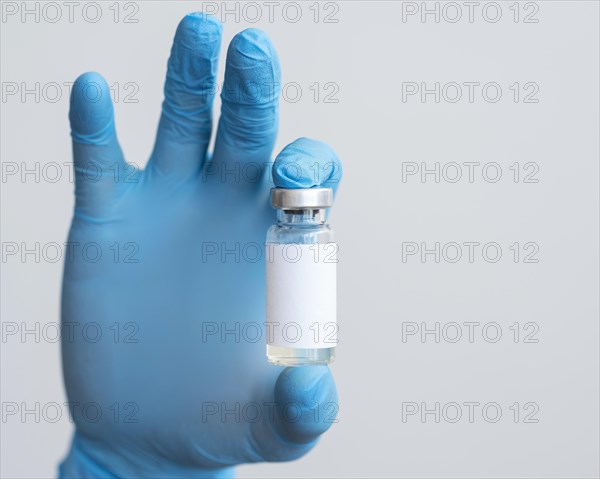 Doctor holding medical vaccine