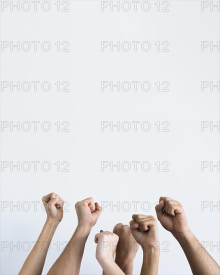 People holding fists up together