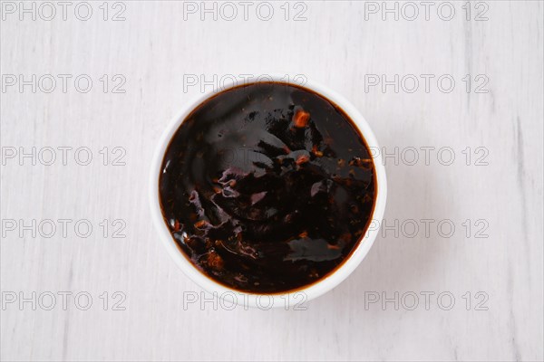 Overhead view of small bowl with spicy teriyaki sauce