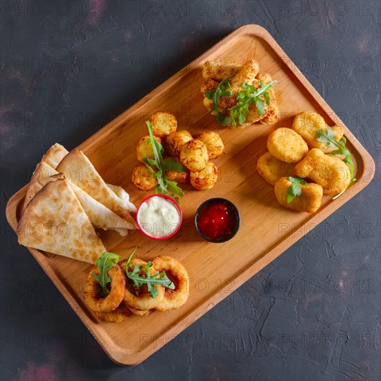 Wooden plate with snack for beer