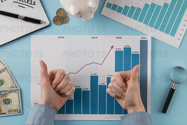 Top view business items with growth chart hands giving thumbs up. Resolution and high quality beautiful photo