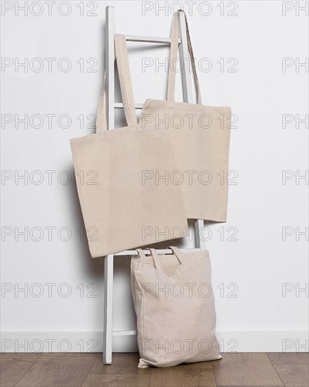 Tote bags arrangement ladder indoors. Resolution and high quality beautiful photo