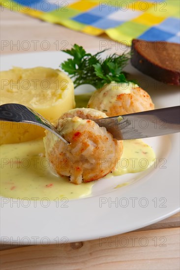 Closeup view of plate with meatballs and mashed potato