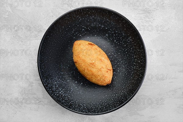 Kiev or pozharskaya cutlet on a plate overhead view