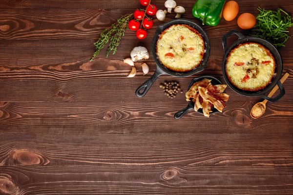 Table with cast-iron pan and spices