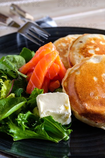 Flapjacks with salmon and fresh salad