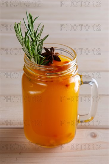 Cup of sea buckthorn tea with citrus