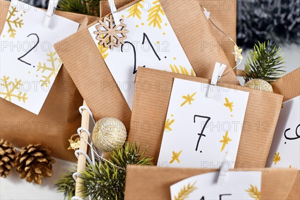 Homemade Advent calendar made from craft paper bags with handwritten numbers