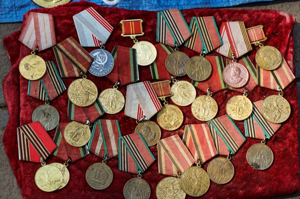 Veteran medals for their labour scattered on a table