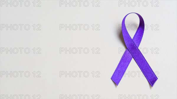 Flat lay frame with purple ribbon