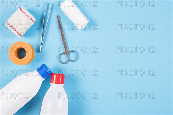 Overhead view wound dressing medical equipments blue background
