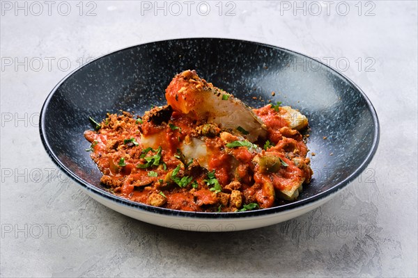 Roasted zander served with steamed tomato