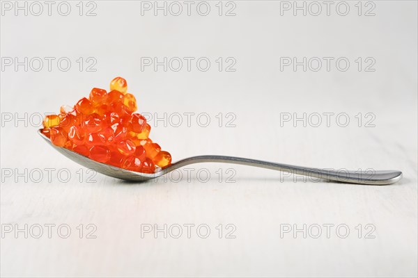 Spoon with salmon red caviar